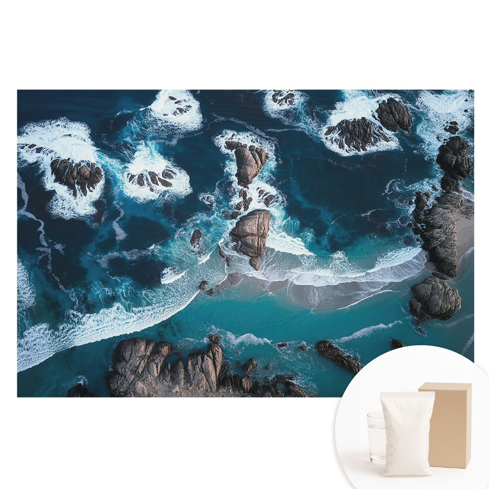 Netkaná fotografická tapeta Pohled na oceán s kameny shora v živých barvách