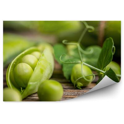 Fototapeta na zeď Zelený hrášek koule větvička dřevěný stůl