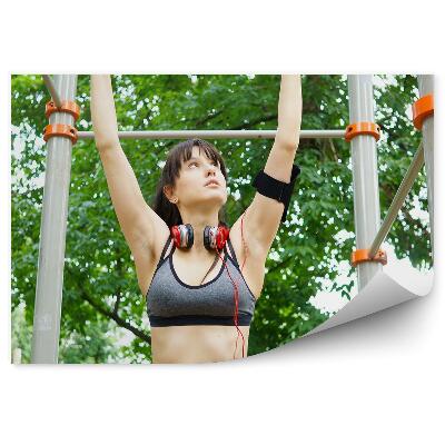 Fototapeta na zeď Žena zvedající na hrazdě