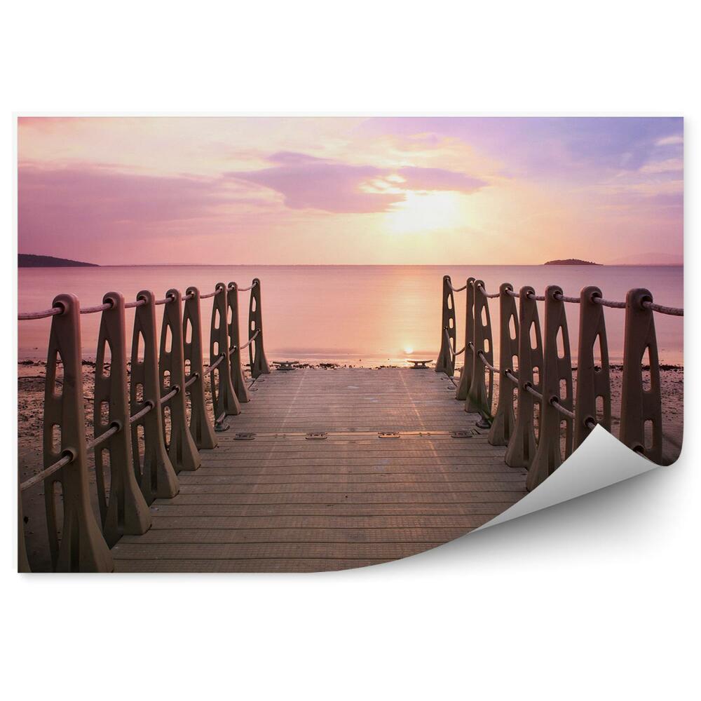 Fototapeta na zeď Růžové světlo slunce nad obzorem plážové molo