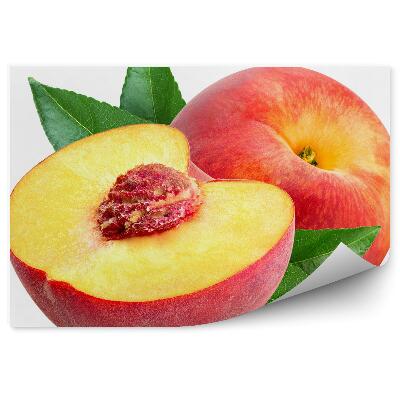 Samolepící fototapeta Broskvová pecka půlka zralého ovoce zelené listy